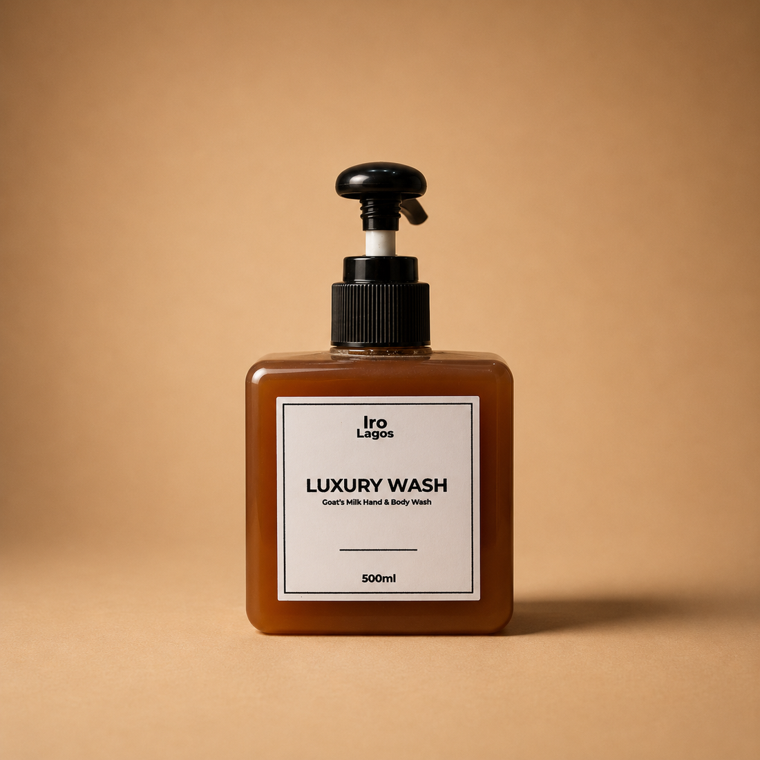 A 500ml bottle of Iro Lagos Luxury Wash hand and body wash, featuring a square amber-brown translucent bottle, a black pump dispenser, and a minimalist white label.